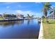 View of a canal with boats and waterfront homes at 2817 Coral Way, Punta Gorda, FL 33950