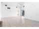 Spacious living room with tile floors and access to the patio at 2817 Coral Way, Punta Gorda, FL 33950