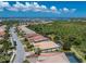 Aerial view of single-Gathering house with pool and lush landscaping at 13191 N Marsh Dr, Port Charlotte, FL 33953