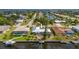 Aerial view of a waterfront property with a pool and dock at 103 Tropicana Dr, Punta Gorda, FL 33950