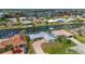 High-angle view of the home, showcasing the canal, surrounding homes, and nearby amenities at 103 Tropicana Dr, Punta Gorda, FL 33950