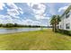 Picturesque view of the lake and golf course from the backyard at 14624 Sycamore Ct # 2521, Punta Gorda, FL 33955