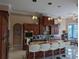 Island kitchen with granite countertops and custom cabinetry at 2761 Newman Dr, North Port, FL 34288
