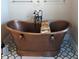 Copper bathtub with decorative accents in a spacious bathroom at 2761 Newman Dr, North Port, FL 34288