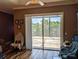 Bedroom with sliding glass doors leading to a patio and water views at 2761 Newman Dr, North Port, FL 34288