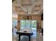 Game room with a pool table and sliding doors to a pool view at 2761 Newman Dr, North Port, FL 34288