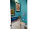 Small bathroom with teal walls and blue glass sink at 2761 Newman Dr, North Port, FL 34288