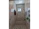 Walk-in shower with marble and geometric patterned tile at 2761 Newman Dr, North Port, FL 34288