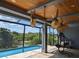 Relaxing pool area with lanai and water view at 2761 Newman Dr, North Port, FL 34288