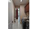 Well-lit laundry room with washer, dryer, and ample storage at 2761 Newman Dr, North Port, FL 34288