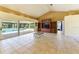 Spacious living area with tile floors and access to the pool at 16681 Acapulco Rd, Punta Gorda, FL 33955