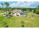 Aerial view of home, pool, and expansive backyard at 16681 Acapulco Rd, Punta Gorda, FL 33955