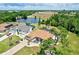 Aerial view of property with large backyard and a lake view at 16681 Acapulco Rd, Punta Gorda, FL 33955