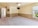 Bright bedroom with neutral walls, carpet flooring, and double door access to patio at 16681 Acapulco Rd, Punta Gorda, FL 33955