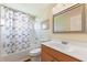 Clean bathroom with wood vanity and shower/tub combo at 16681 Acapulco Rd, Punta Gorda, FL 33955