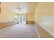 Spacious bedroom with carpet, ceiling fan, and sliding doors to patio at 16681 Acapulco Rd, Punta Gorda, FL 33955