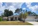 Charming ranch-style home with a well-maintained lawn at 1525 Heberling Ave, North Port, FL 34288