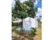 White shed with a gray deck in the backyard at 1525 Heberling Ave, North Port, FL 34288