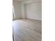 Light and airy bedroom with vinyl plank flooring at 1525 Heberling Ave, North Port, FL 34288