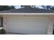 White garage door with house number 1525 at 1525 Heberling Ave, North Port, FL 34288
