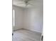 Bright bedroom with light flooring and ceiling fan at 1525 Heberling Ave, North Port, FL 34288