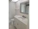 Clean bathroom with white vanity and a large mirror at 1525 Heberling Ave, North Port, FL 34288