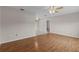 Bright living room featuring wood floors, neutral walls, and a ceiling fan for added comfort at 1585 Harmony Dr, Port Charlotte, FL 33952