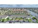An aerial view of condo with beige exterior, parking and beautifully landscaped with waterfront and neighborhood views at 4000 Bal Harbor Blvd # 214, Punta Gorda, FL 33950