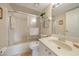 A clean bathroom with a shower-tub combo, vanity, and neutral tones for a refreshing experience at 4000 Bal Harbor Blvd # 214, Punta Gorda, FL 33950