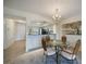 Charming dining space adjacent to kitchen with modern appliances and living area with comfortable sofa at 4000 Bal Harbor Blvd # 214, Punta Gorda, FL 33950