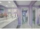A stylish bathroom with double sinks, white cabinets, sleek lighting, and a separate toilet and shower area at 4000 Bal Harbor Blvd # 214, Punta Gorda, FL 33950