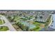 Aerial view showing community pool and tennis courts at 4000 Bal Harbor Blvd # 214, Punta Gorda, FL 33950