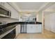 Modern kitchen with stainless steel appliances and dark countertops at 4000 Bal Harbor Blvd # 214, Punta Gorda, FL 33950