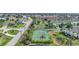 Community tennis court nestled in lush landscaping at 4000 Bal Harbor Blvd # 214, Punta Gorda, FL 33950