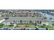 Aerial view of condo building with parking and landscaping at 4000 Bal Harbor Blvd # 214, Punta Gorda, FL 33950