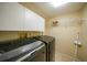 Laundry room with washer, dryer, and shelving for storage at 4000 Bal Harbor Blvd # 214, Punta Gorda, FL 33950