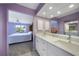 Bright bathroom with double vanity and view of bedroom at 4000 Bal Harbor Blvd # 214, Punta Gorda, FL 33950