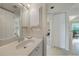 Small bathroom with single sink vanity and access to other rooms at 4000 Bal Harbor Blvd # 214, Punta Gorda, FL 33950