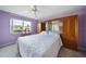 Relaxing bedroom with a king-size bed, large built-in wardrobe, and sliding glass doors at 4000 Bal Harbor Blvd # 214, Punta Gorda, FL 33950