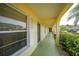 Yellow building with green walkway and landscaping at 4000 Bal Harbor Blvd # 214, Punta Gorda, FL 33950