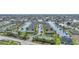 Aerial view of waterfront community with tennis courts and pool at 4000 Bal Harbor Blvd # 214, Punta Gorda, FL 33950