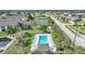 Community pool area with surrounding tropical plants at 4000 Bal Harbor Blvd # 214, Punta Gorda, FL 33950