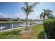 Serene waterfront view, featuring boats and lush greenery at 4000 Bal Harbor Blvd # 214, Punta Gorda, FL 33950