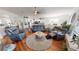Open living room with comfortable seating and views into the kitchen at 10034 Winding River Rd, Punta Gorda, FL 33950