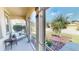 Relaxing screened porch with seating area overlooking the yard at 10034 Winding River Rd, Punta Gorda, FL 33950