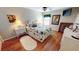 Cozy bedroom with hardwood floors, featuring a full bed and decorative accents at 10034 Winding River Rd, Punta Gorda, FL 33950