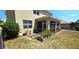 Spacious backyard with screened patio, landscaping, and fenced enclosure at 10034 Winding River Rd, Punta Gorda, FL 33950