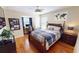 Spacious bedroom with hardwood floors, a desk, and a full-size bed at 10034 Winding River Rd, Punta Gorda, FL 33950