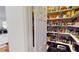 Large pantry with ample shelving for food storage at 10034 Winding River Rd, Punta Gorda, FL 33950