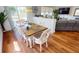 Bright dining room with wood floors and modern table at 10034 Winding River Rd, Punta Gorda, FL 33950